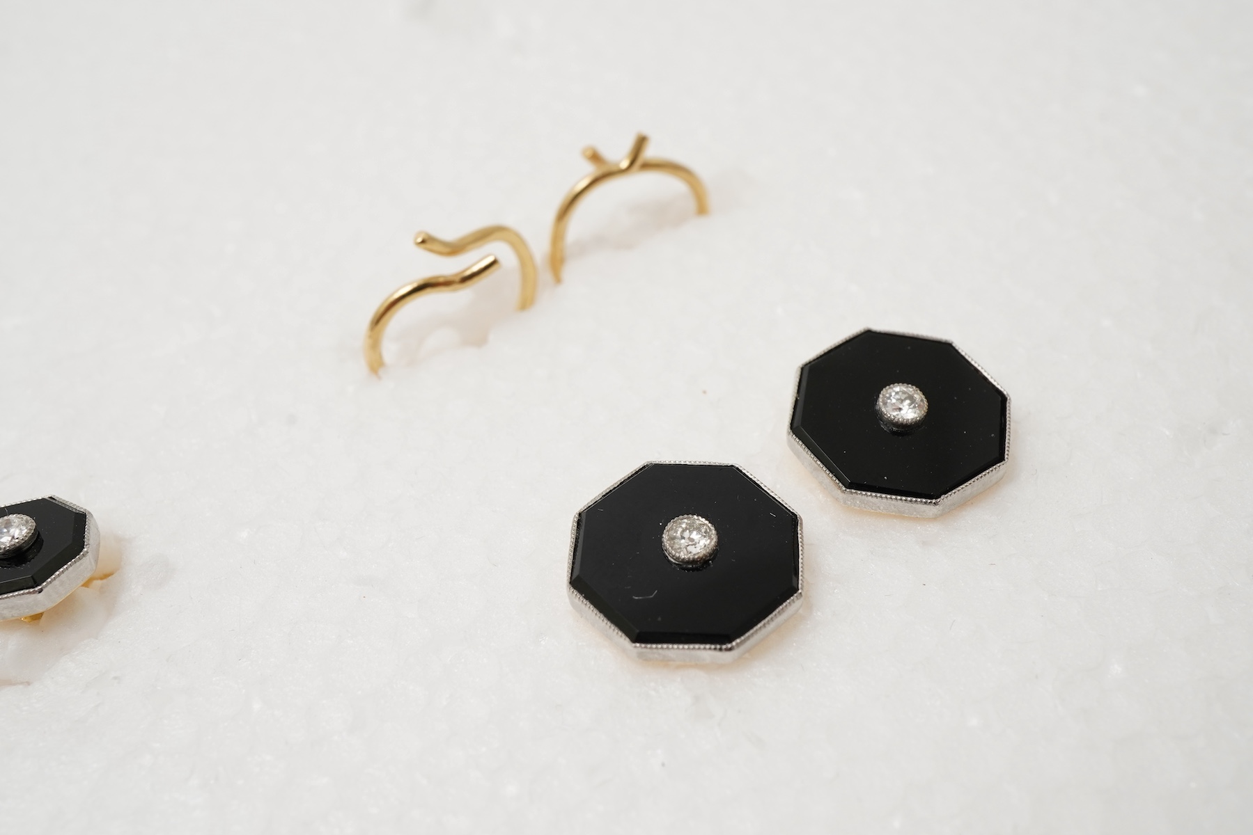 Retailed by Mappin & Webb, an Art Deco onyx and diamond dress set, circa 1920